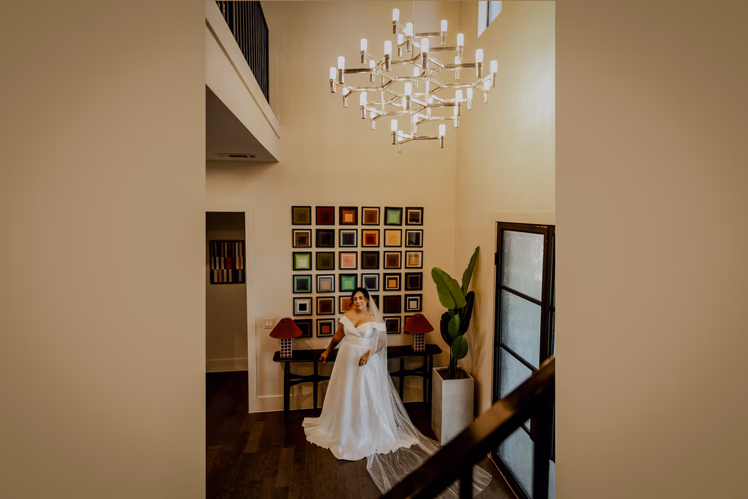 Bride in elegant wedding dress in luxury entryway perfect for micro wedding weekend celebrations at Dallas-Fort Worth venue