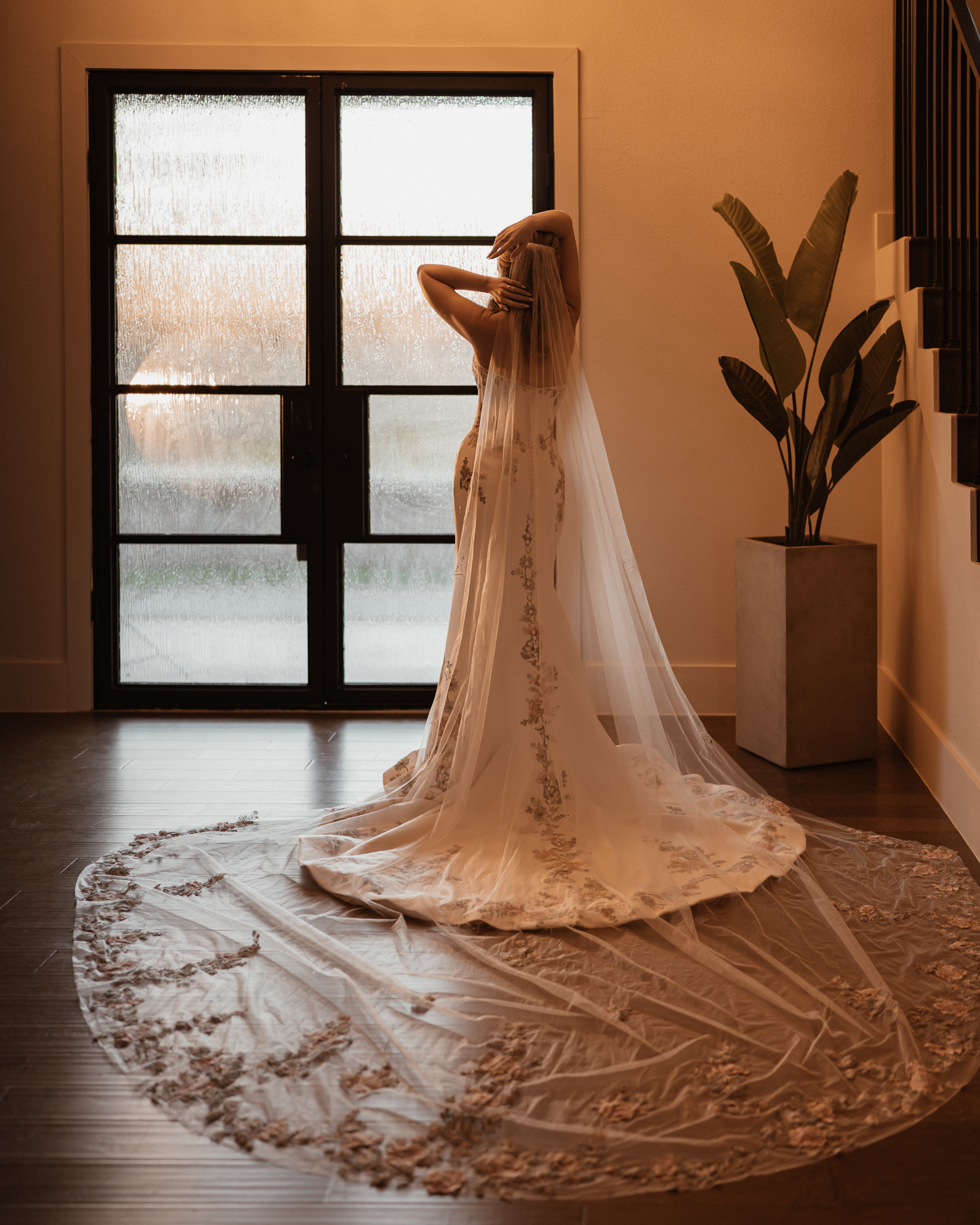 Bride in the foyer showing her floral lace train and cathedral veil before the ceremony at The Penrose House