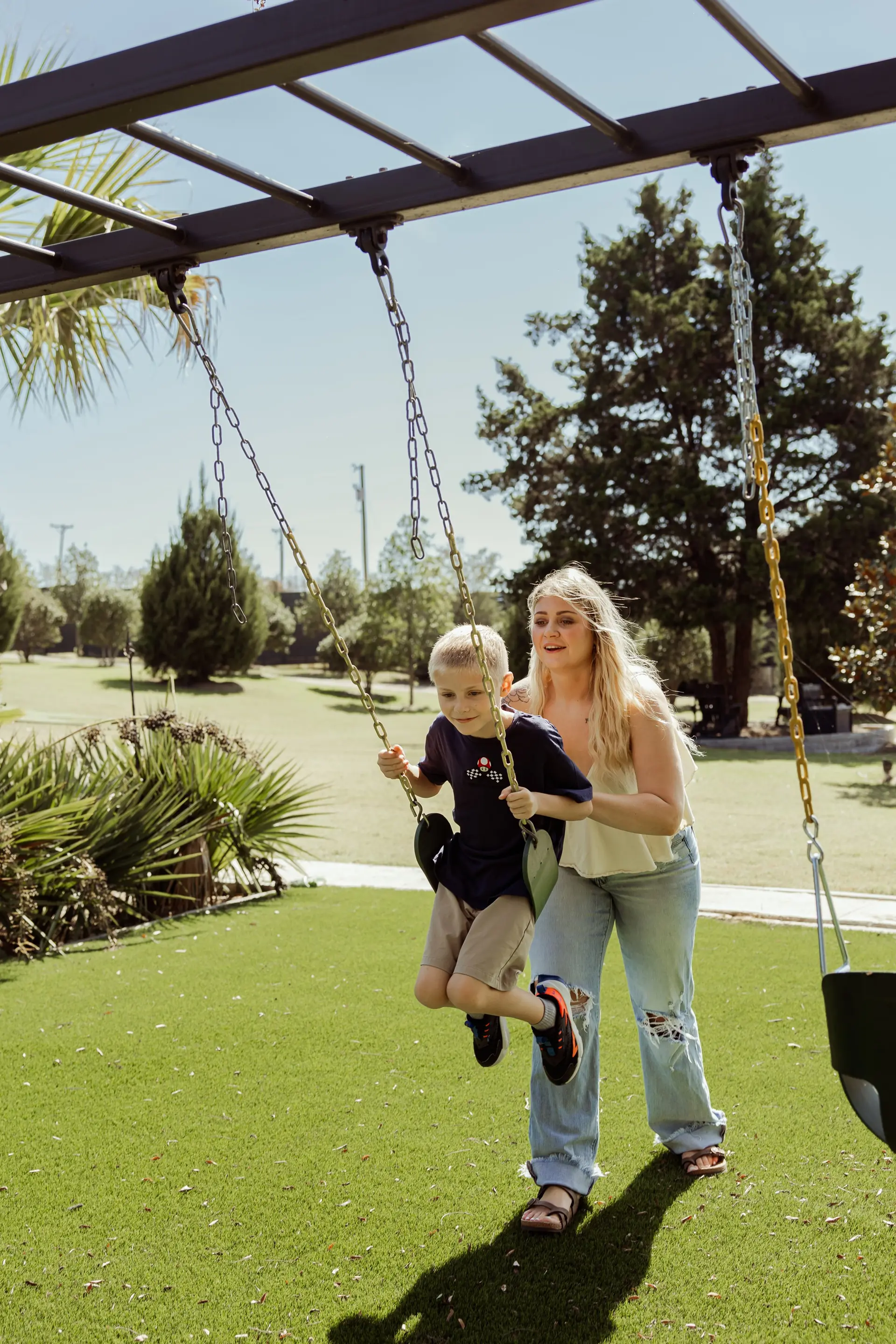 Family enjoying playground and outdoor activities at The Penrose House