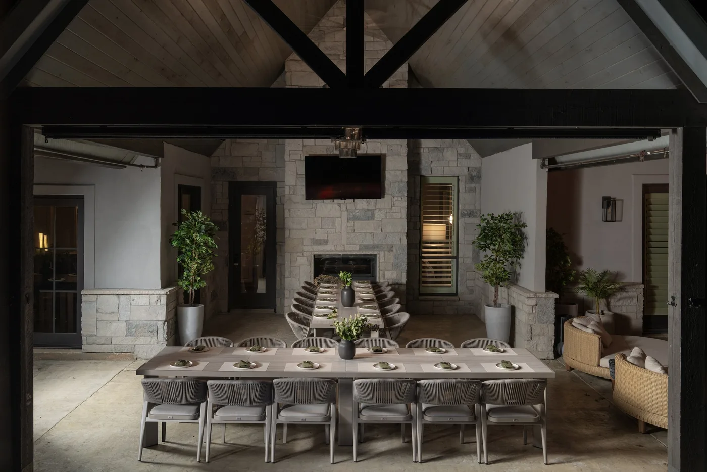 Outdoor dining pavilion with stone fireplace at The Penrose House