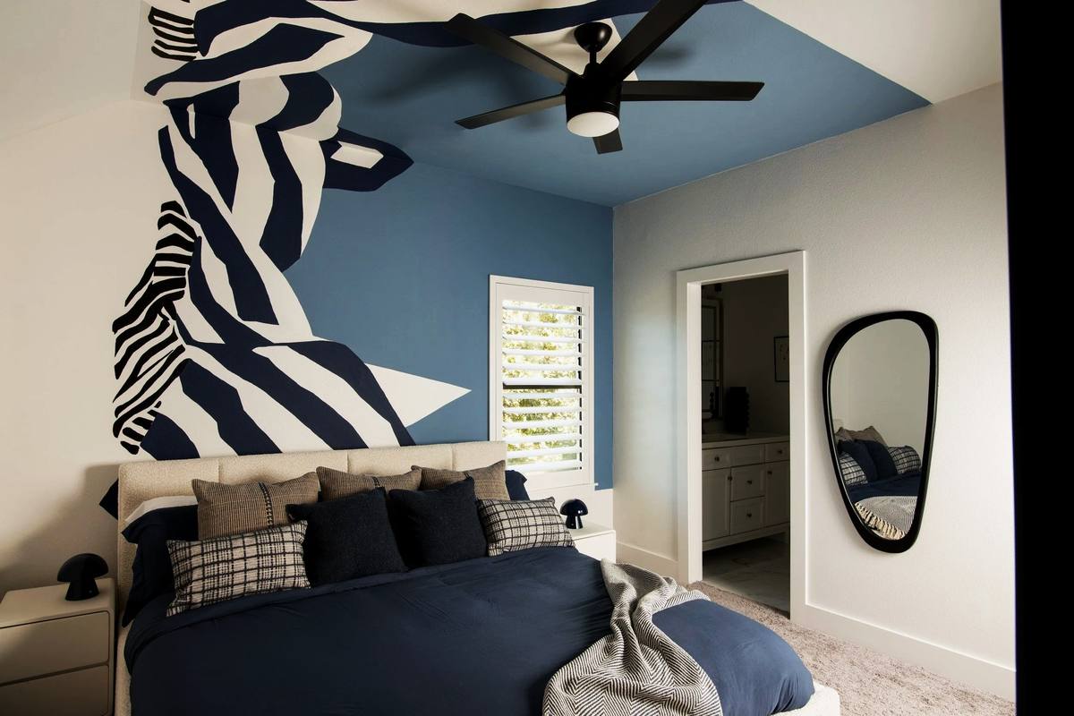 Bedroom with zebra mural and blue accent wall, The Penrose House