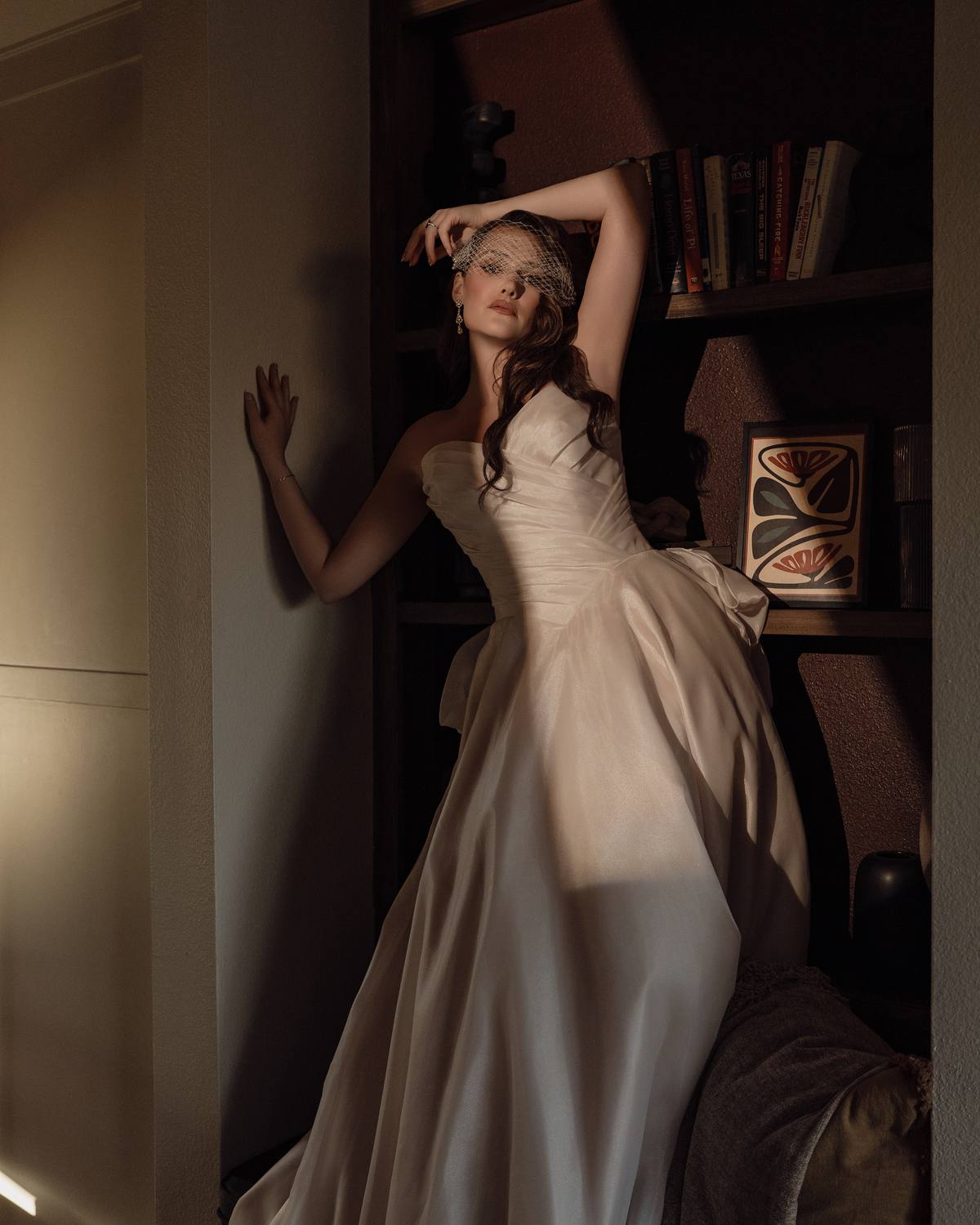 Moody bridal portrait in the library nook, The Penrose House