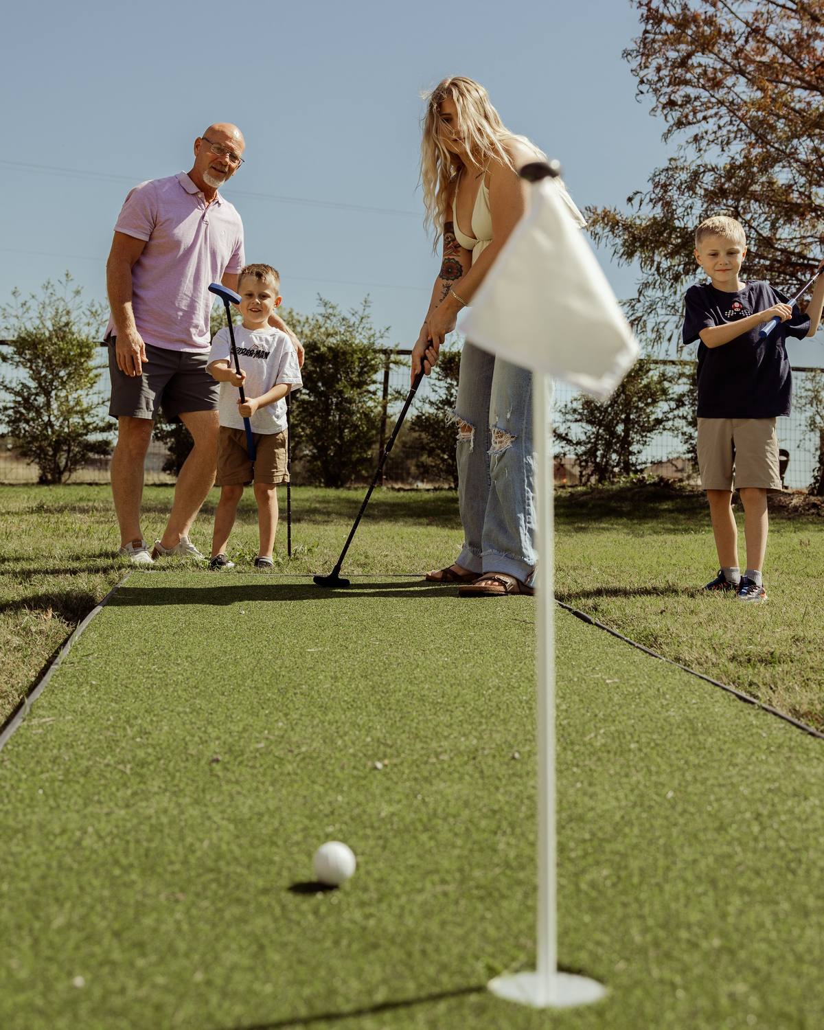 Family on the putting green, The Penrose House