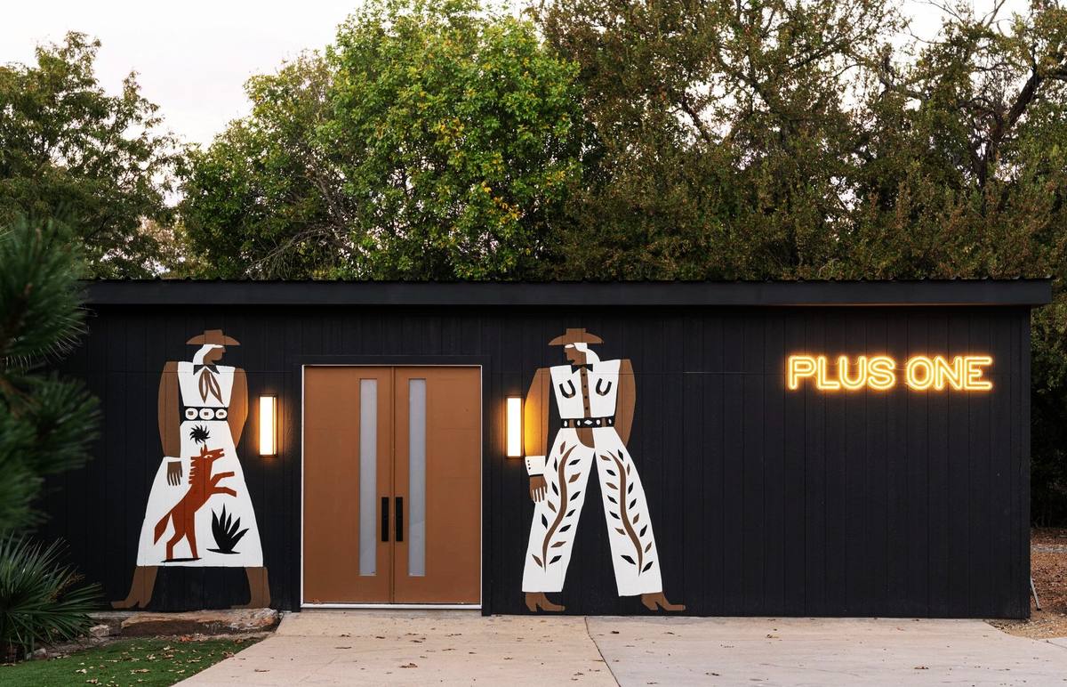 Plus One Lounge exterior with cowboy murals and neon sign, The Penrose House