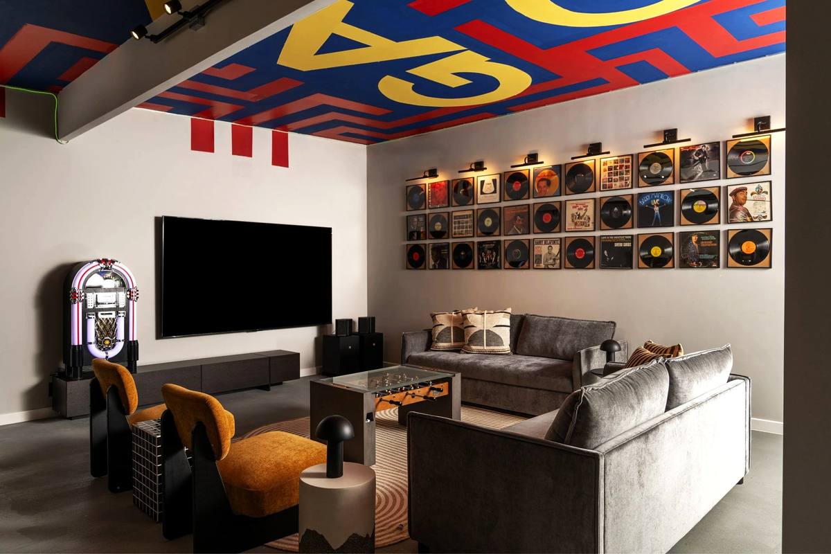 Lounge with jukebox, large screen and vinyl wall, The Penrose House